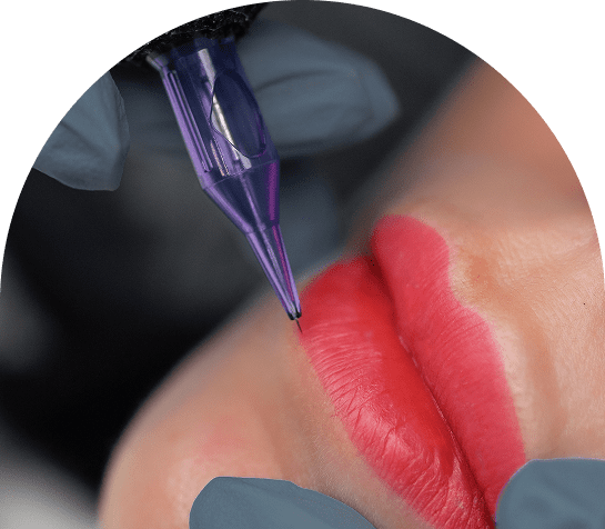 Lip tattoo procedure with tattoo machine.