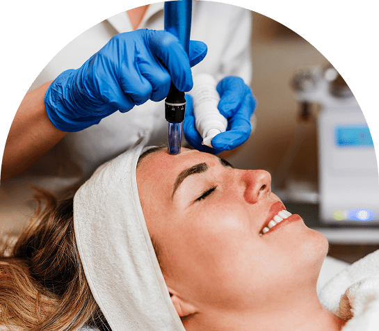 Facial treatment with a microdermabrasion device.