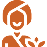 Smiling person holding a leaf