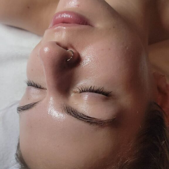 Close-up of person relaxing, nose ring visible