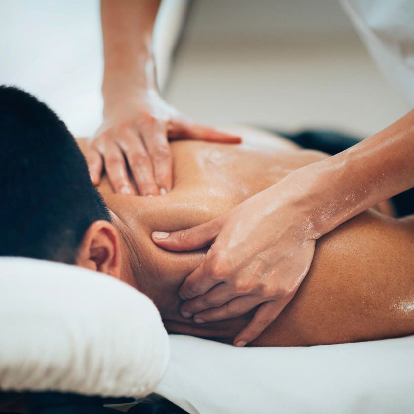 Person receiving shoulder and back massage